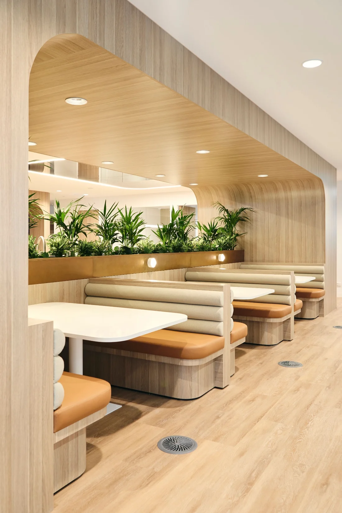 Level 9 timber-framed breakout booths with integrated planting