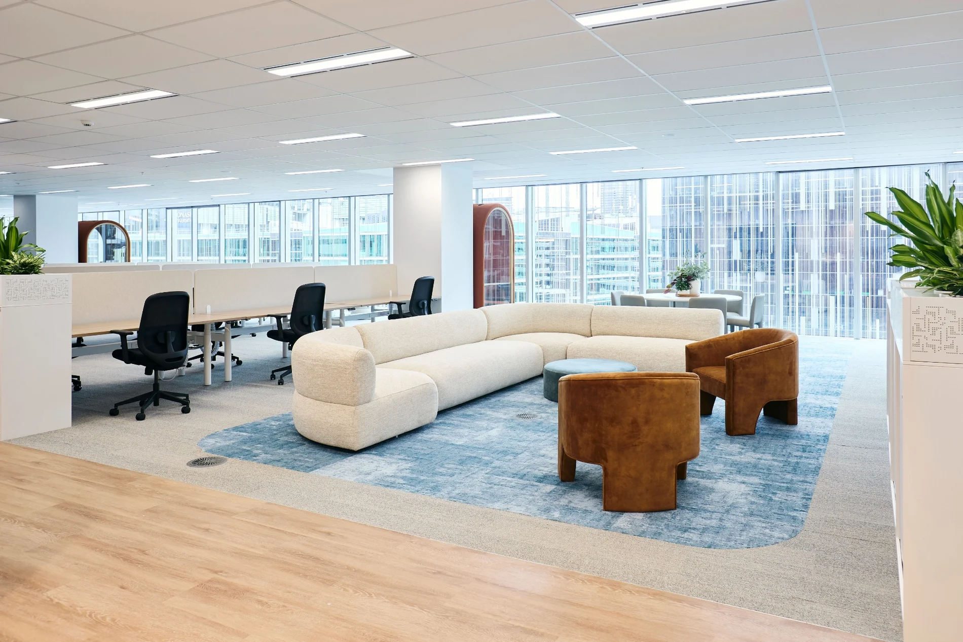 Level 9 workplace lounge with city views at 717 Bourke Street