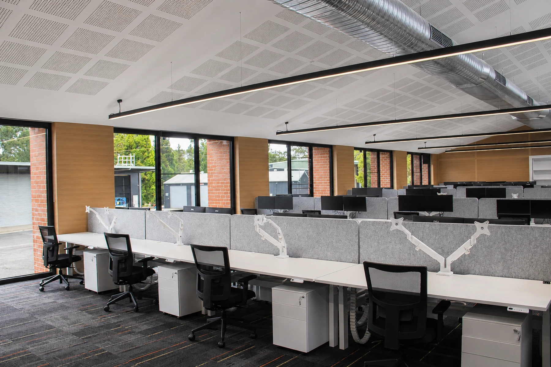 DEECA Broadford open workplace with integrated linear lighting and exposed services