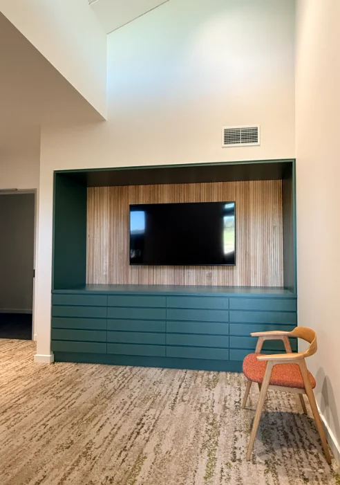 Completed integrated television and timber wall joinery