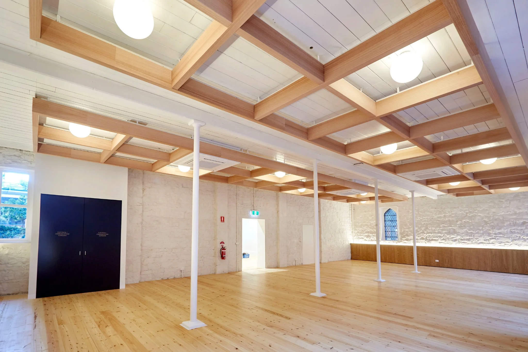 Long interior view through the restored School House